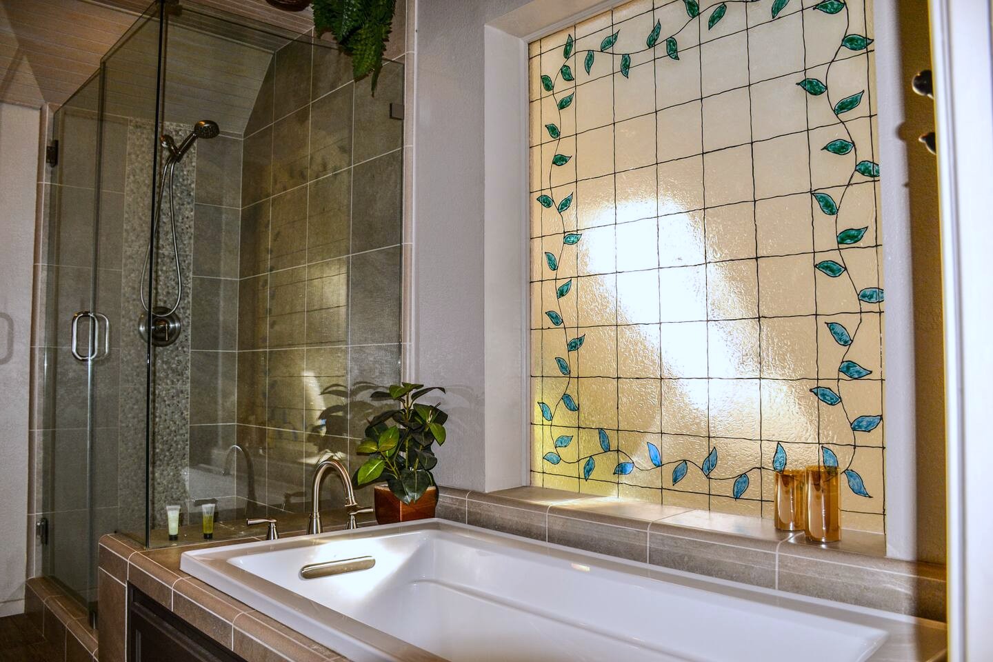 The soaking tub and stained-glass window