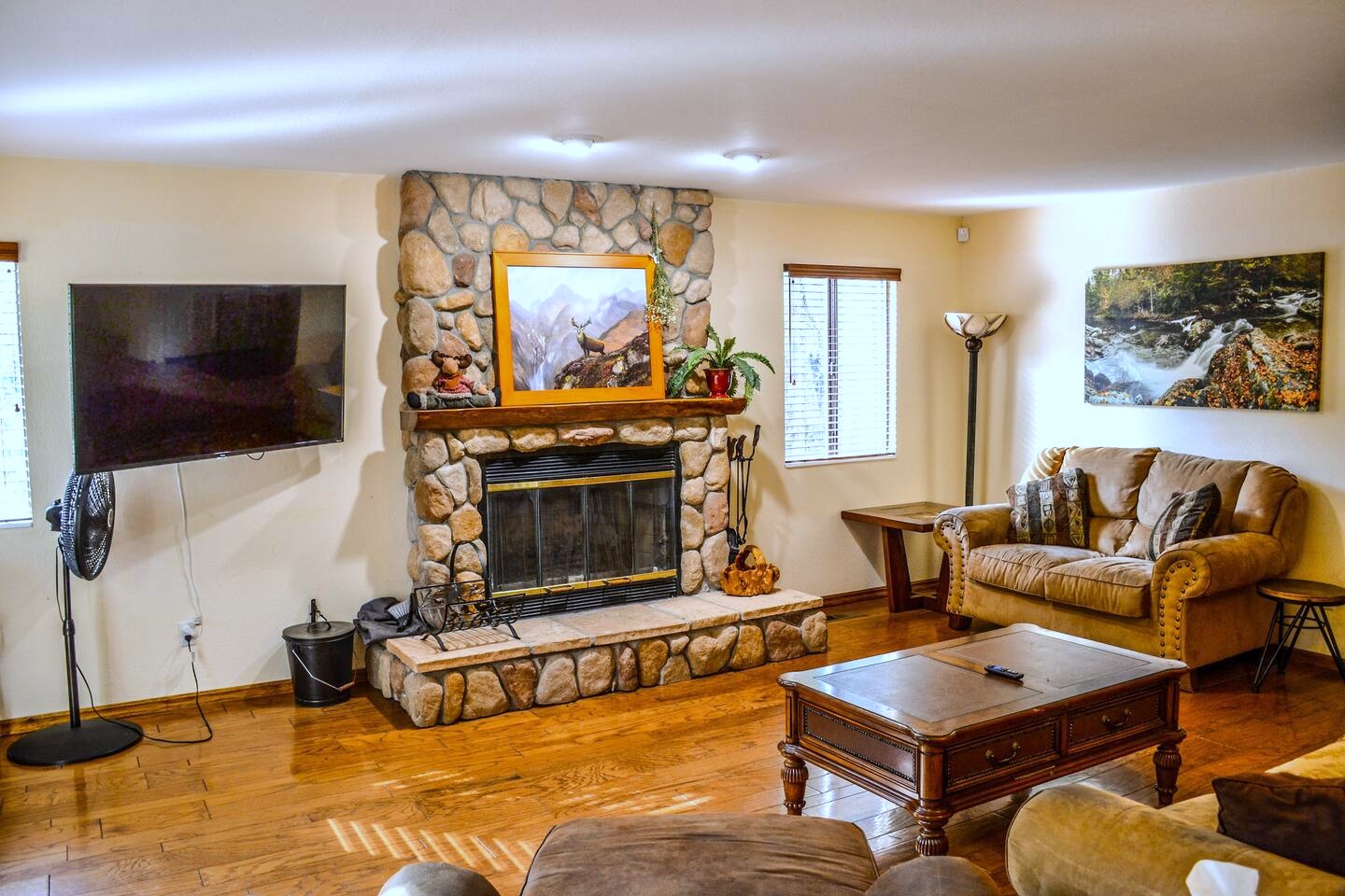 The gathering room and river-rock fireplace